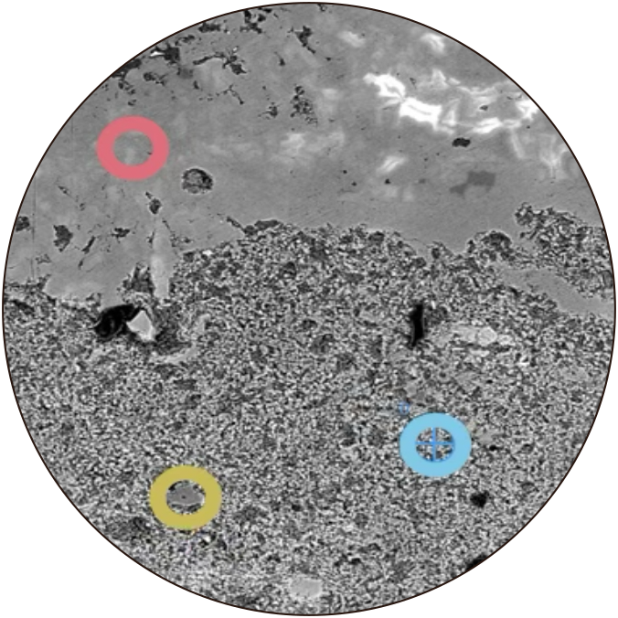 as SEM image of a soil carbonate sample with spots highlighted